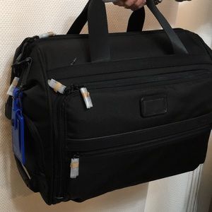 Tumi soft duffel black carry on suitcase